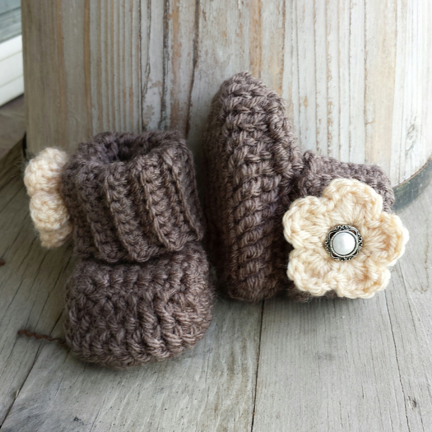 Crochet baby girl boots in brown with tan flower and pearl