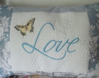 Embroidered "Love" Pillow Done in Blues with Butterfly and Extra Stitching