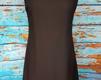 60s black ruffled dress, very Audrey hepburn.