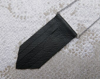 Pendant with black leather fringe