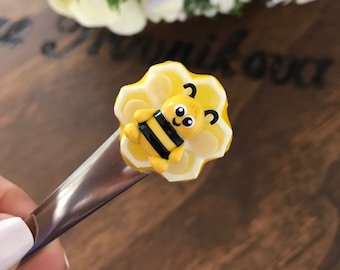 Tea spoon with adorable kawaii honey bee