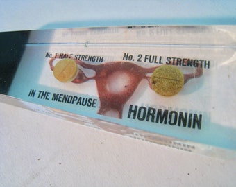 Vintage advertising letter opener. Hormonin Menopause pill. Lucite handle with uterus, fallopian tubes, ovaries, pills. circa 1980s.