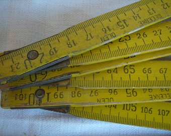 Vintage ruler folding yellow vintage double-meter, is retro, gadgets and tools