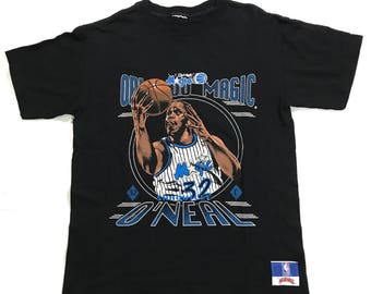 Vintage 90s Orlando Magic Shaq T Shirt by nutmeg Tag is ripped fits like S, shaq t shirt, vintage orlando shaq shirt, orlando magic shirt