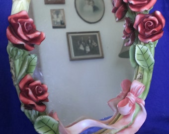 ornate oval rose mirror/ picture frame
