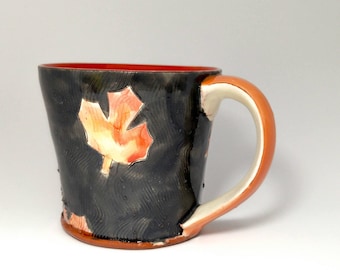Grey maple leaf themed Earthenware mug. Wheel thrown, food safe leafy mug made by Kaitlyn Brennan