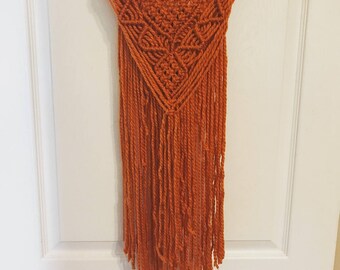 Orange macrame wall hanging