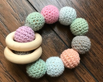 Crocheted wooden baby rattle