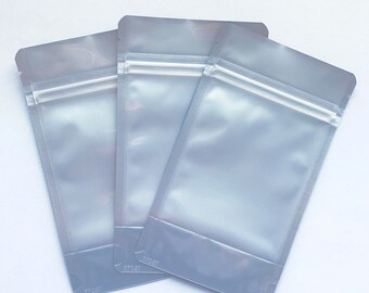 100-SILVER/CLEAR Foil Stand Up Pouches, Choose from 3 Sizes, Heavy Duty 5.4mil, Tear Notch, Zipper + Impulse Sealable, Two Wild Hares