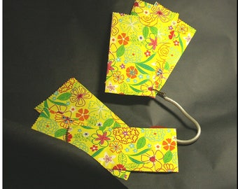 Set of 8 pouches gift to celebrate Easter and spring. Yellow bottoms, printed patterns red and green