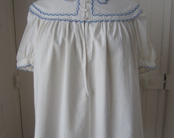 Blouse with scalloped embroidery