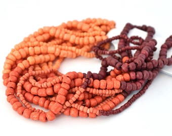 Assortment of orange, red, plum seed beads, size 1.5 mm to 4 mm