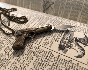 Miniature fake gun pocket knife necklace