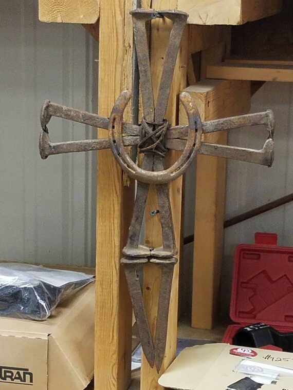 Railroad spike and horseshoe cross