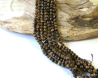TigerEye - Faceted Tiger Eye - 8mm Round - 15 1/2 Inch Strand of 47 Beads
