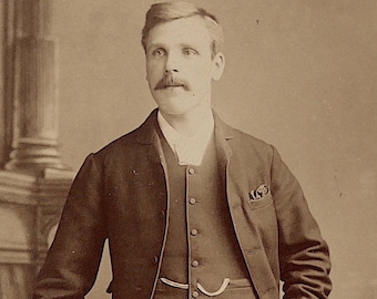 Cabinet card, antique. Featuring a well dressed young gentleman. A. & G. Taylor, 95 Newgate St. Newcastle. c late 1890's.