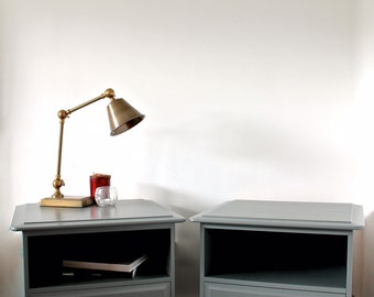 A Pair Of Vintage Stag Minstrel Bedside Tables / Cabinets in grey.