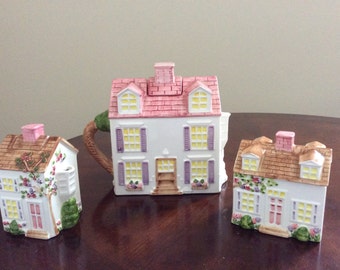 A Unique Set Coffee/Tea Pot with Sugar and Creamer Home Figurals, Expressly Made for Lord & Taylor.
