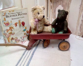 French antique toy cart with wooden pull along handle and little yellow wheels