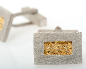 Cuff links with silver and gold leaf