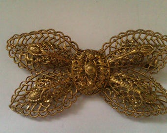 vintage filigree butterfly shaped brooch