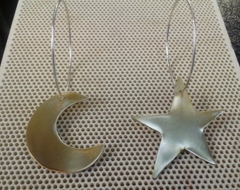 Sterling silver star and moon earrings.