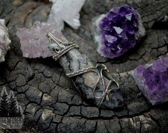 pendant from nickel silver, pendant with petrified coral, pendant with stone, petrified coral, braided pendant, wirewrap