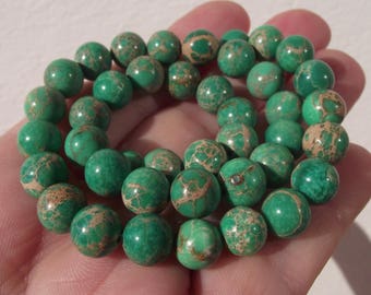 4 ROUND MULTICOLORED 8 MM GREEN JASPER BEADS.