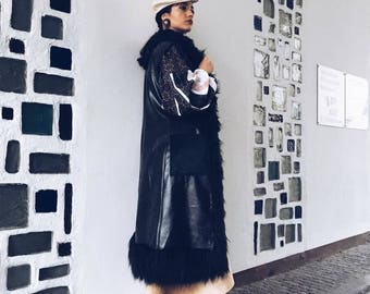 Long black faux-leather and faux-fur vest