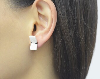 Folded, abstract earrings, white porcelain earrings, black silver. Geometric minimalist studs. Contemporary jewelry. Ceramic earrings