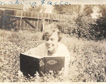 Vintage Photo "Making Faces" Funny Expression Woman Reading A Book Handwritten Caption Found Vernacular Photo