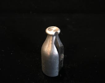 Vintage aluminum milk bottle pencil sharpener.