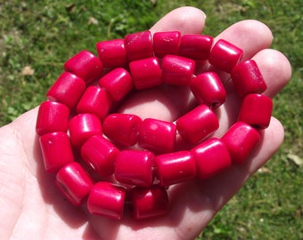 2 LARGE PEARLS 11-13 X 10-11 MM RED CORAL.
