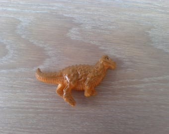 Magnet depicting a dinosaur