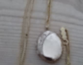 Vintage oval shaped rolled gold locket and chain