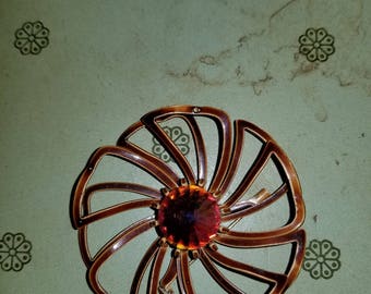 Red swirl brooch