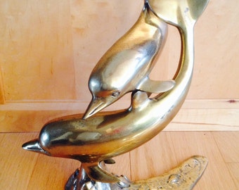 large brass dolphin figurine
