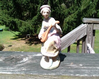 Lovely Lady Playing a Mandolin by L & M Inc