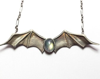 Silver Bat Wings Necklace with Oval Labradorite Cabochon Nestled Inside