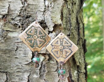 Handmade etched copper earrings.