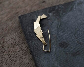 Single gold articulated fish Earrings