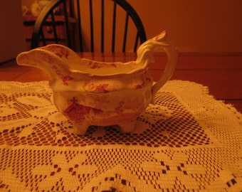 Transferware Staffordshire pink transferware CREAMER with embossed feet