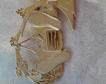 Goldtone Brooch/Girl With Big Feet Swinging On Tree Bench