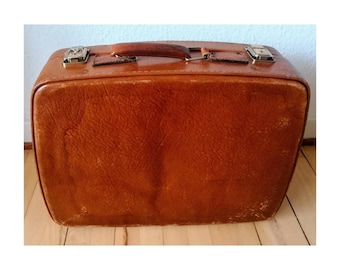Vintage leather suitcase with key
