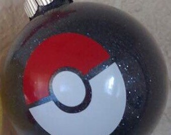 From the cartoon series Pokemon we have d our black glitter ball ornament features a po