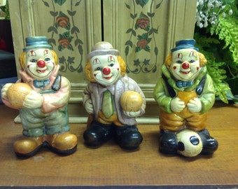VINTAGE CERAMIC CLOWNS,Happy clowns holding basketball and soccer ball