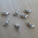 Set of 5 beads 7x14x4.5mm antique silver colored metal bird.