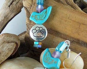 Gotta have a bird on it! Eye catching, and lighter than you might think. The paw prints always a conversation starter!