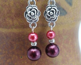 Rose accented red pearl earrings