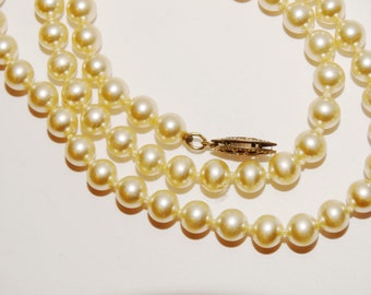 Sterling Silver 19" Long marked Clasp Pearl Necklace.